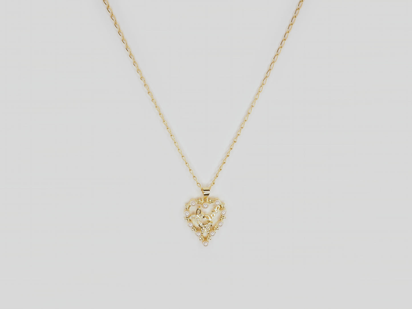 Gold plated necklace 18k. Beautiful handmade necklace with gold heart pendant with pearls and crystal butterflies by Xatli. Gold plated necklace Canada. 18k gold plated chain. Affordable jewelry for every occasion.