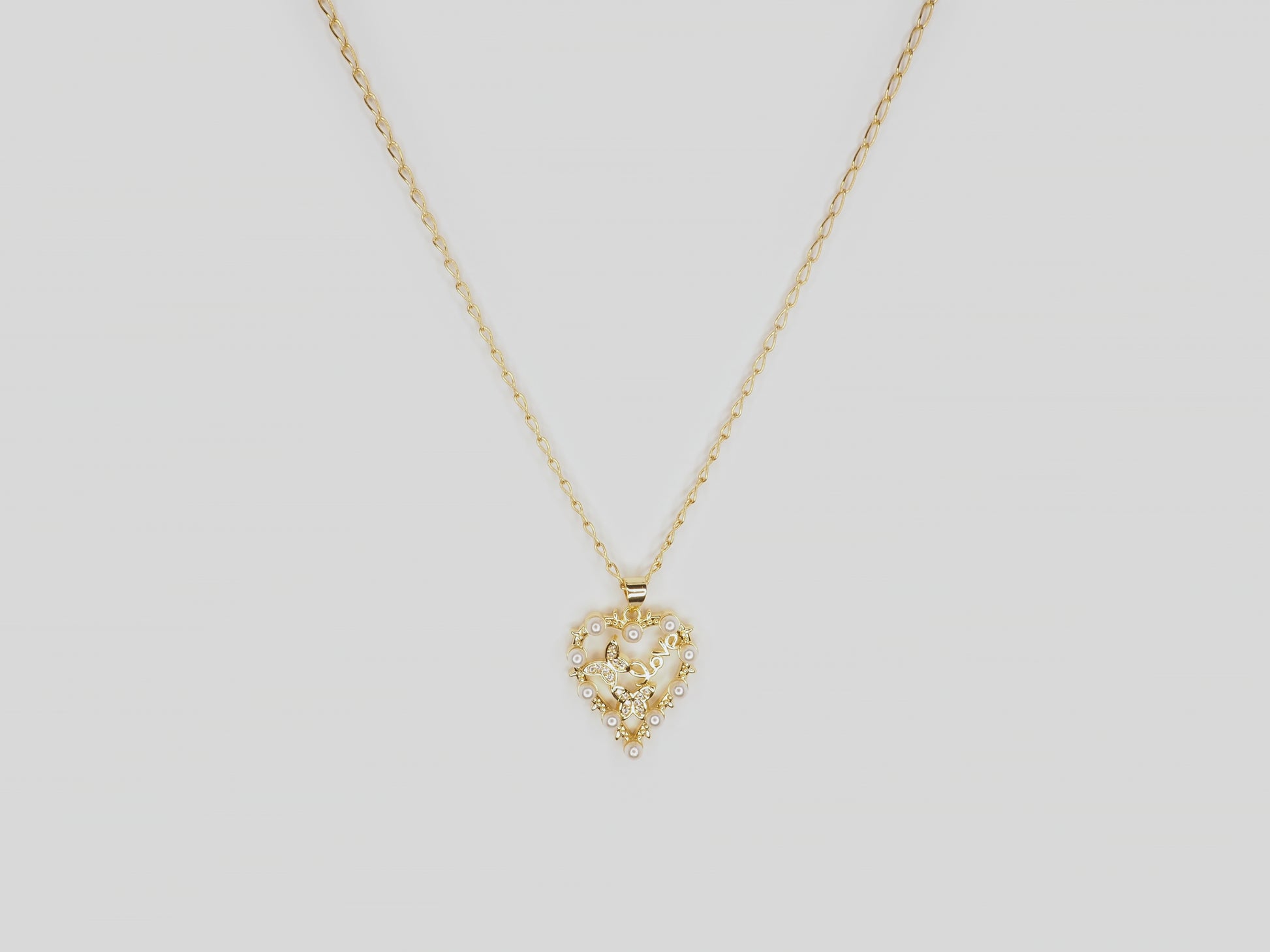 Gold plated necklace 18k. Beautiful handmade necklace with gold heart pendant with pearls and crystal butterflies by Xatli. Gold plated necklace Canada. 18k gold plated chain. Affordable jewelry for every occasion.