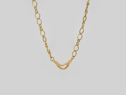 Hands shaping a heart pendant necklace in Gold plated 18k. Chain Made Gold Plated 18k  Beautiful handmade necklace. Gold plated chain necklace by Xatli. Gold plated necklace Canada. 18k gold plated chain. Affordable jewelry for every occasion. Length: 18 inches 