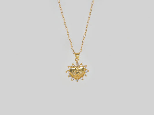 Heart with evil eye pendant in gold with Zircons. Gold Plated 18k Necklace with Zircons Beautiful handmade necklace. Gold plated chain necklace with heart pendant in gold with zircons by Xatli. Gold plated necklace Canada. 18k gold plated chain. Affordable jewelry for every occasion.